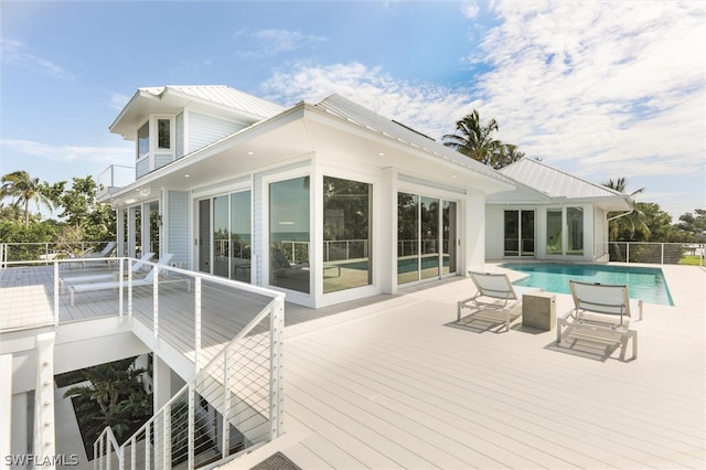 exterior space with a swimming pool side deck