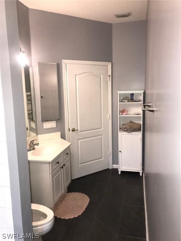 bathroom with vanity and tile patterned flooring