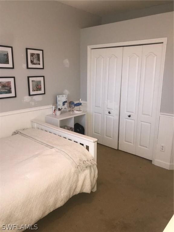 carpeted bedroom featuring a closet