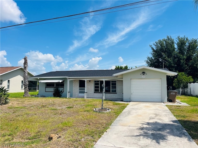 single story home featuring a garage and a front lawn