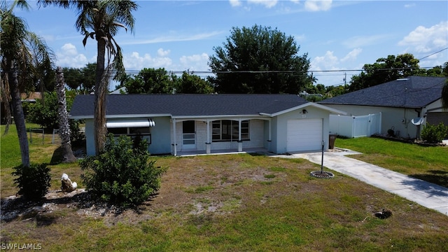 ranch-style house featuring a garage and a front yard