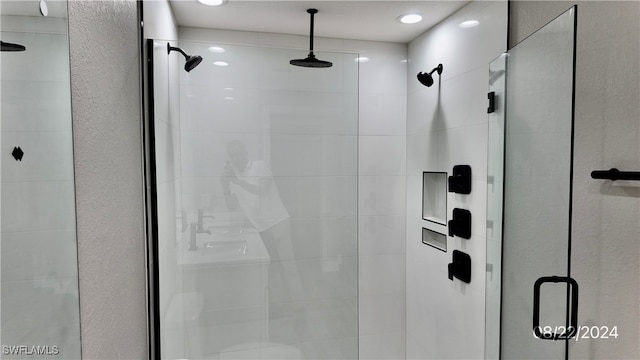 bathroom with a shower with shower door