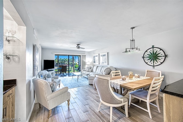 dining space featuring light hardwood / wood-style flooring and ceiling fan