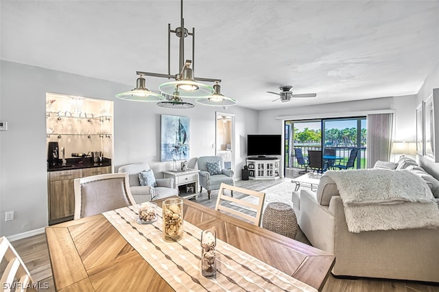 living room with hardwood / wood-style flooring and ceiling fan