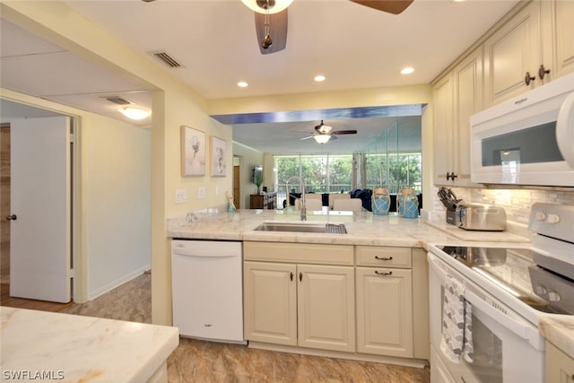 kitchen with white appliances, sink, ceiling fan, tasteful backsplash, and light stone counters