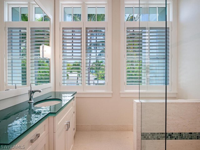 1270 Gulf Shore Blvd S, Naples, FL 34102 - bathroom with tile patterned flooring, vanity, and baseboards
