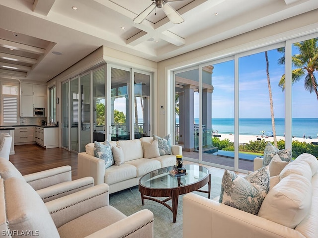 1270 Gulf Shore Blvd S, Naples, FL 34102 - living room featuring beam ceiling, a water view, a ceiling fan, wood finished floors, and coffered ceiling