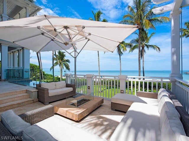 1270 Gulf Shore Blvd S, Naples, FL 34102 - exterior space with a water view and an outdoor living space with a fire pit