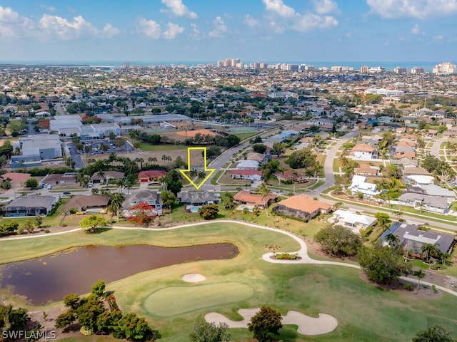 aerial view featuring a view of city, a water view, golf course view, and a residential view