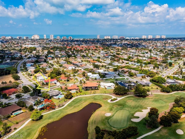 aerial view with a city view, a water view, a residential view, and golf course view