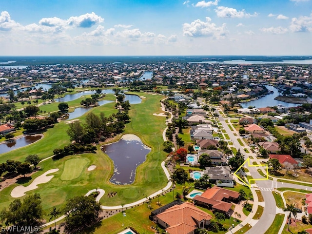 aerial view with a water view, golf course view, and a residential view