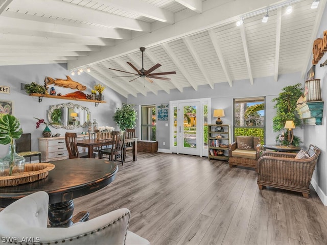 interior space featuring hardwood / wood-style floors, lofted ceiling with beams, ceiling fan, and rail lighting