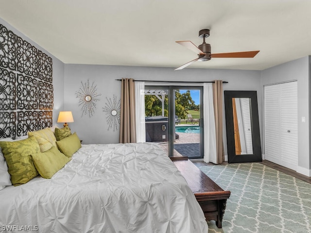 bedroom featuring access to outside and a ceiling fan