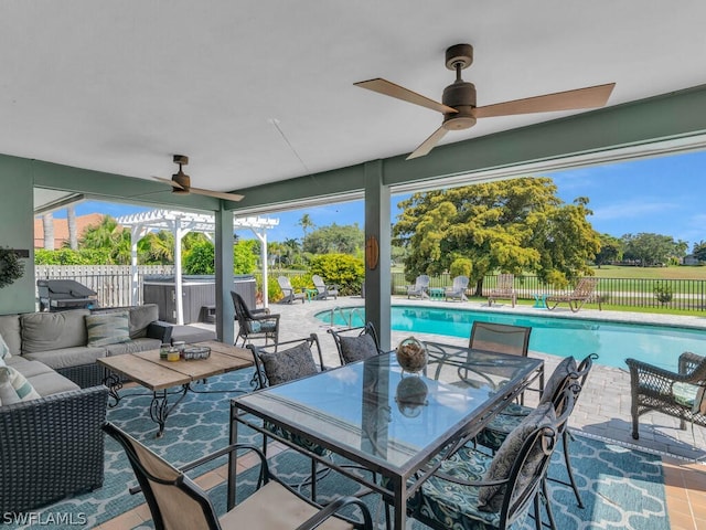view of patio / terrace featuring a hot tub, an outdoor hangout area, ceiling fan, a fenced backyard, and a fenced in pool