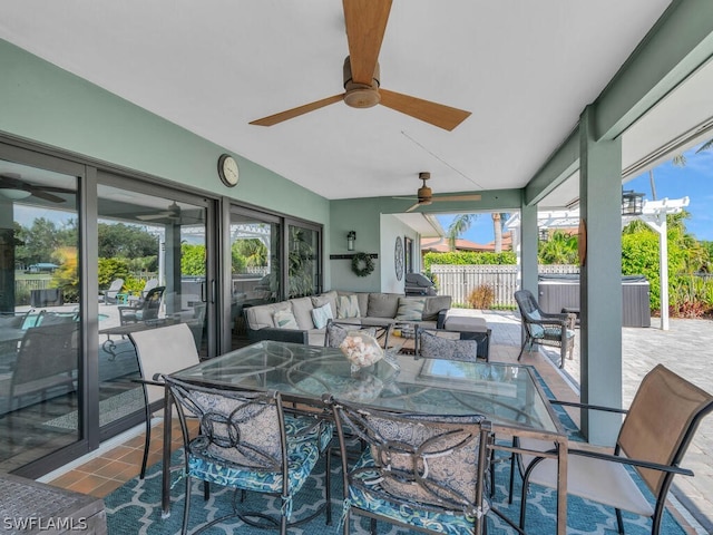 sunroom featuring plenty of natural light and ceiling fan