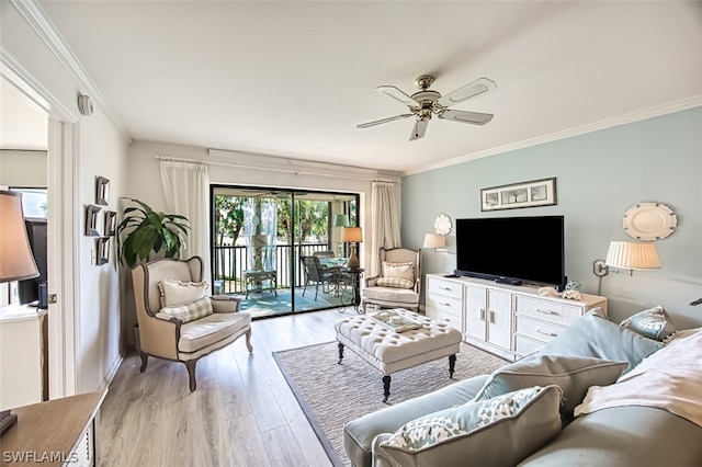 living room with ceiling fan, ornamental molding, and light hardwood / wood-style floors