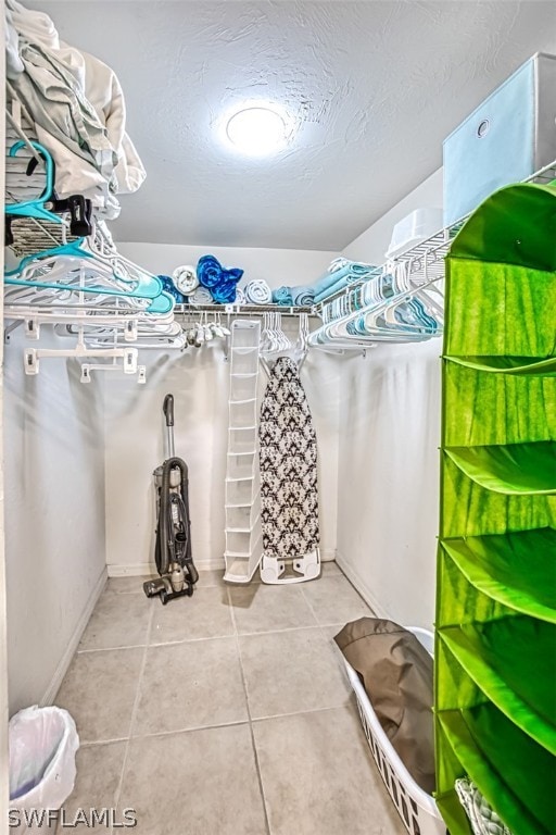 walk in closet featuring light tile patterned floors