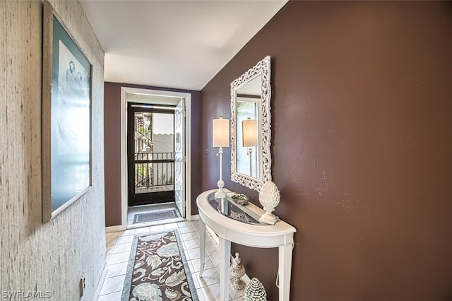 doorway with light tile patterned flooring