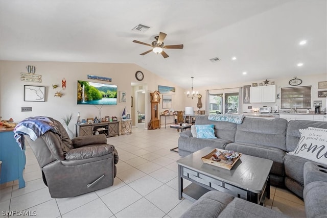 living room featuring light tile patterned floors, ceiling fan with notable chandelier, vaulted ceiling, and sink