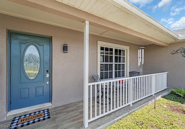 property entrance featuring a porch