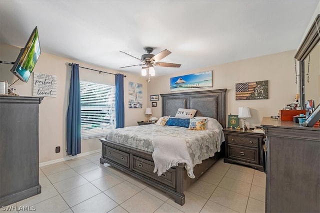 tiled bedroom featuring ceiling fan