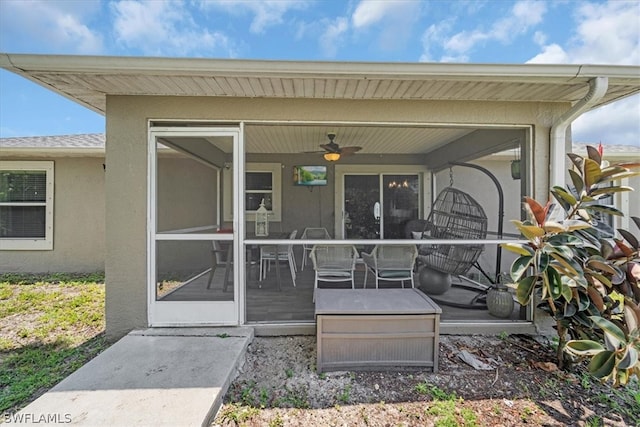 entrance to property featuring ceiling fan