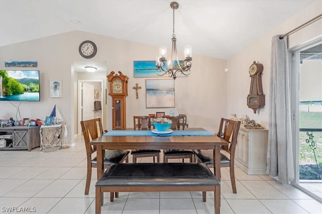 tiled dining area with an inviting chandelier and vaulted ceiling