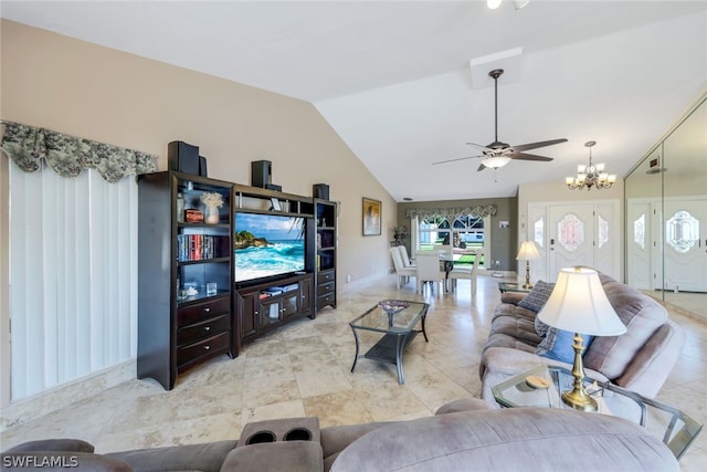 living room with ceiling fan with notable chandelier and vaulted ceiling