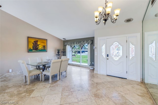 entryway with a notable chandelier and lofted ceiling