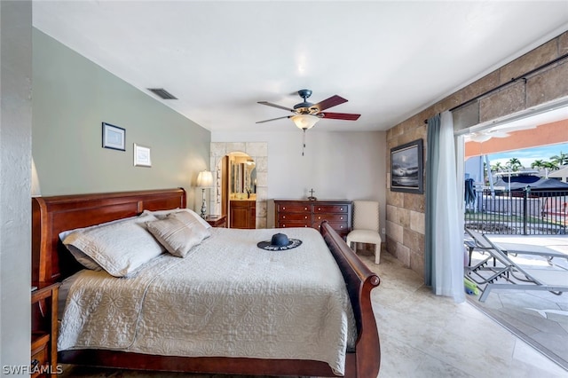 bedroom featuring ceiling fan and access to outside