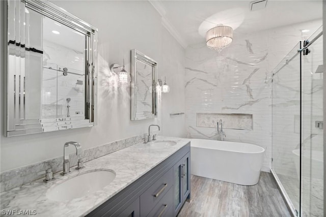 bathroom featuring hardwood / wood-style floors, vanity, separate shower and tub, and crown molding