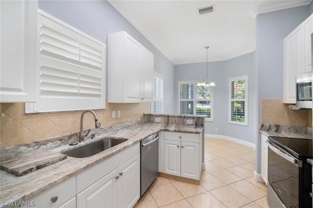 kitchen featuring ornamental molding, light stone countertops, stainless steel appliances, white cabinetry, and a sink