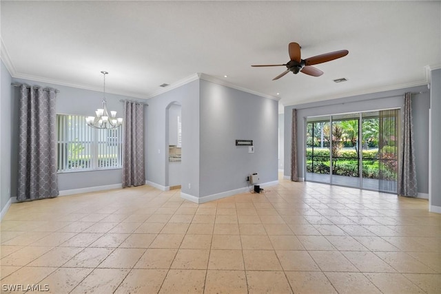 unfurnished room with a healthy amount of sunlight, baseboards, visible vents, and crown molding