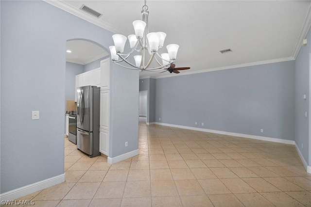 spare room featuring ornamental molding, light tile patterned flooring, visible vents, and baseboards