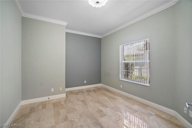 empty room featuring ornamental molding and baseboards