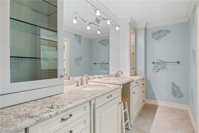 bathroom featuring tile patterned flooring, vanity, and crown molding