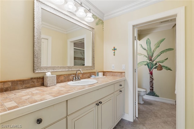 bathroom featuring crown molding, tile patterned flooring, vanity, and toilet