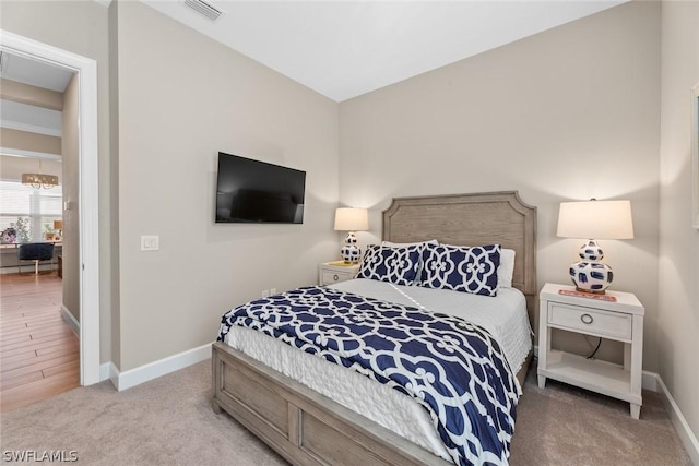 bedroom with light hardwood / wood-style flooring