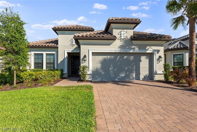 mediterranean / spanish house with a garage