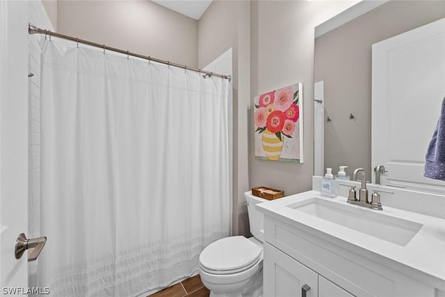 bathroom featuring vanity, hardwood / wood-style flooring, and toilet