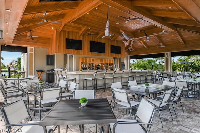 view of patio / terrace featuring a gazebo, a bar, and ceiling fan