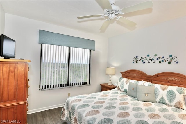 bedroom featuring ceiling fan and dark hardwood / wood-style floors