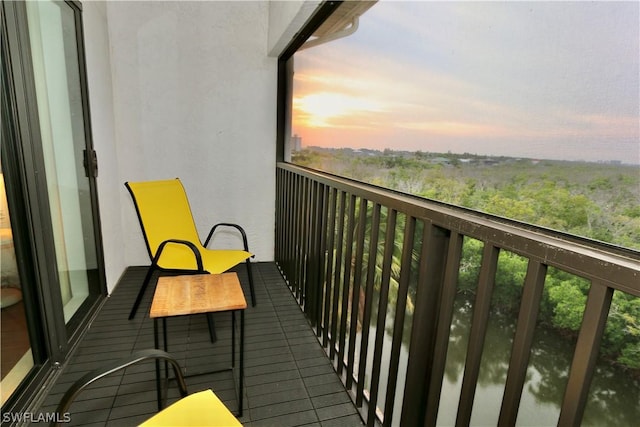 view of balcony at dusk