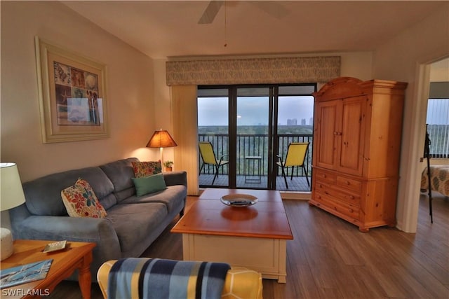 living room featuring hardwood / wood-style flooring and ceiling fan