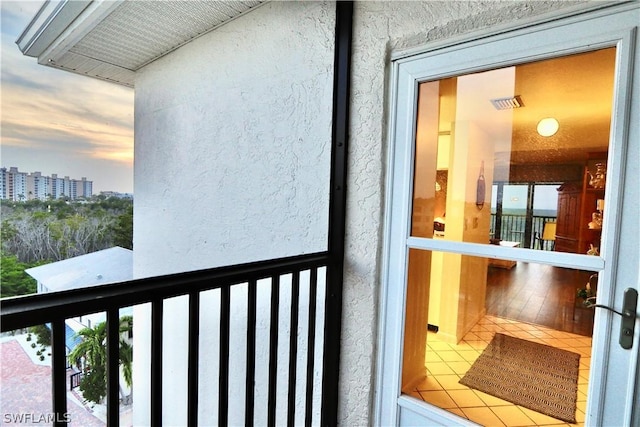 view of balcony at dusk