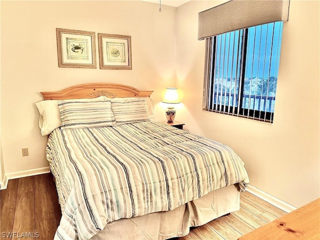 bedroom with hardwood / wood-style flooring