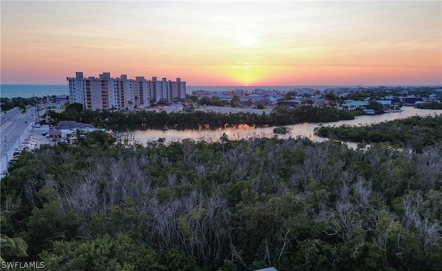 aerial view at dusk with a water view