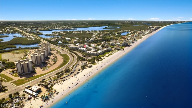 bird's eye view featuring a water view and a view of the beach