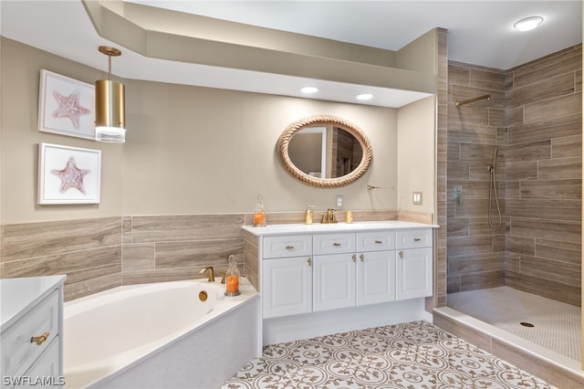 bathroom featuring tile patterned floors, vanity, and separate shower and tub