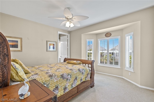 carpeted bedroom featuring ceiling fan